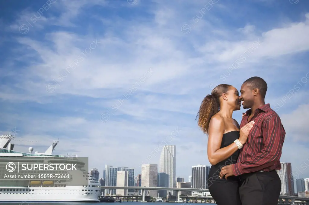 African American couple hugging
