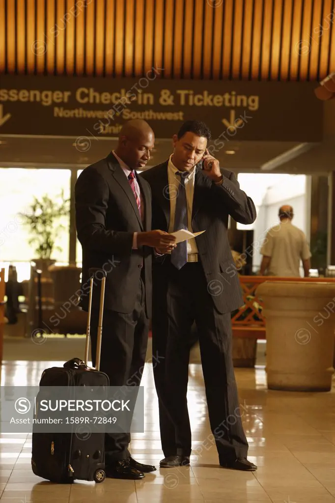 Multi-ethnic businessmen at airport