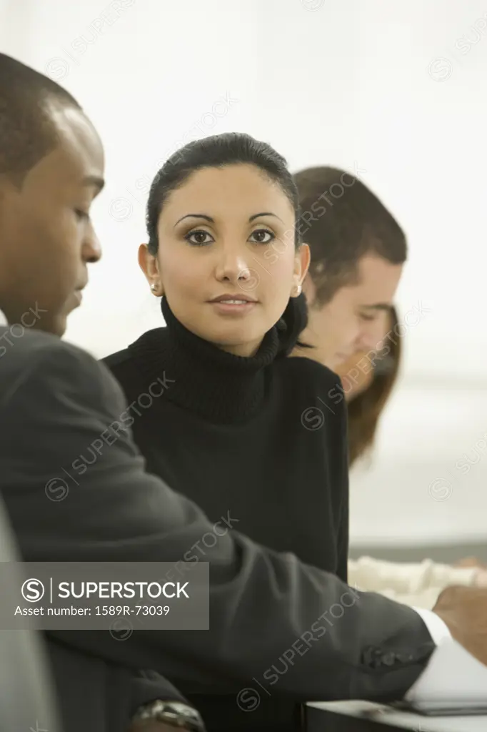 Mixed race businesswoman in meeting