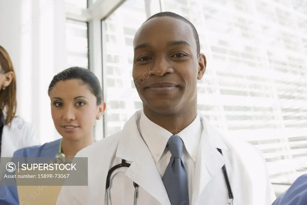 Multi-ethnic doctor and nurse looking confident