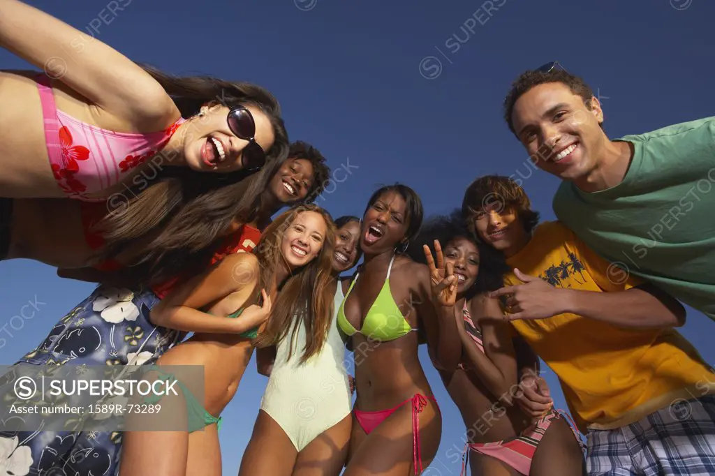 Multi-ethnic group of friends hugging