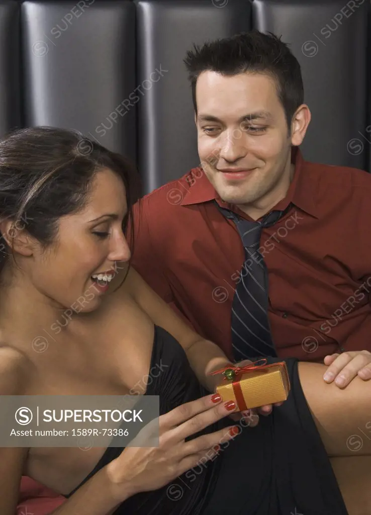 Man giving gift to girlfriend