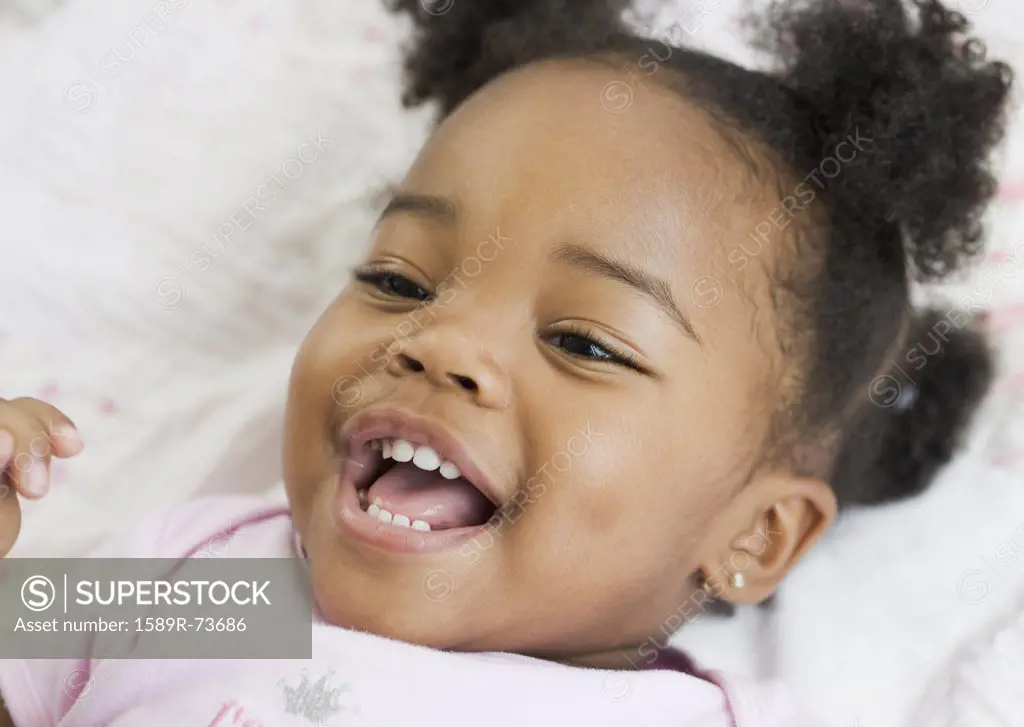 Close up of African American girl laughing