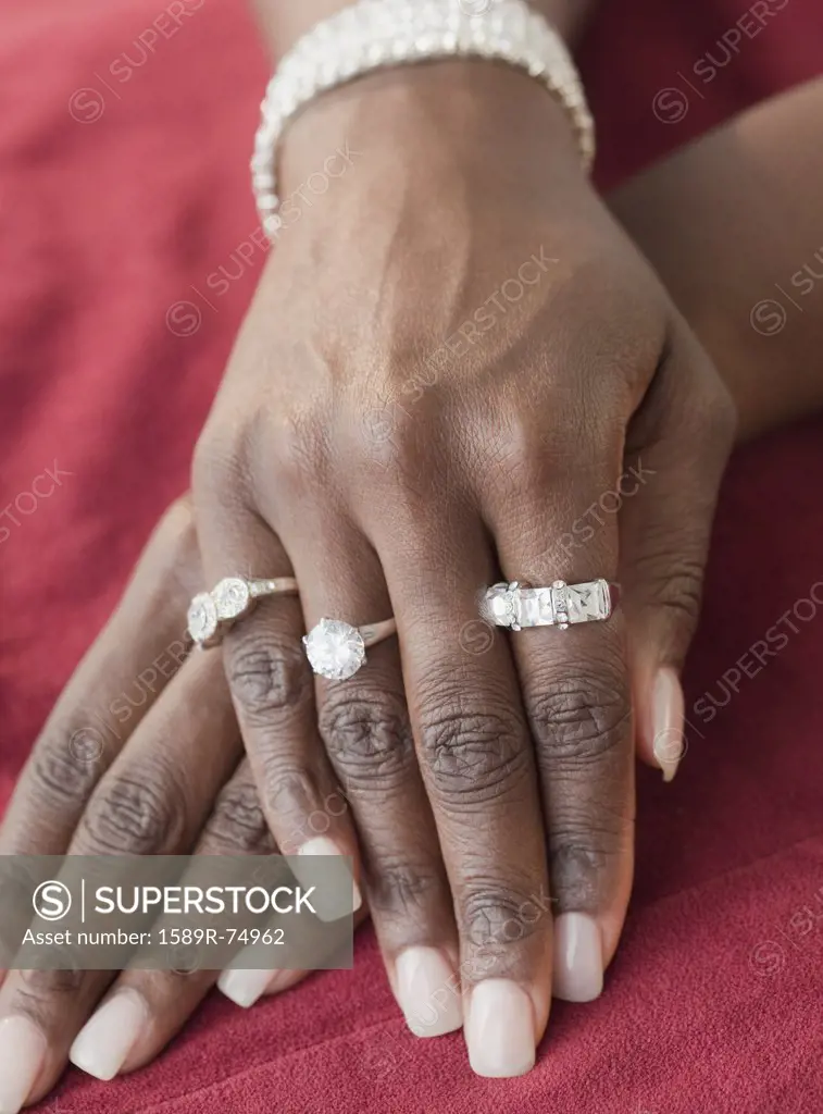 African woman wearing many diamond rings