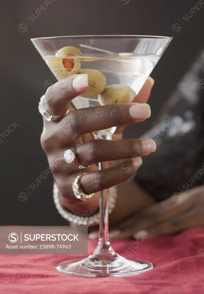 African woman drinking martini