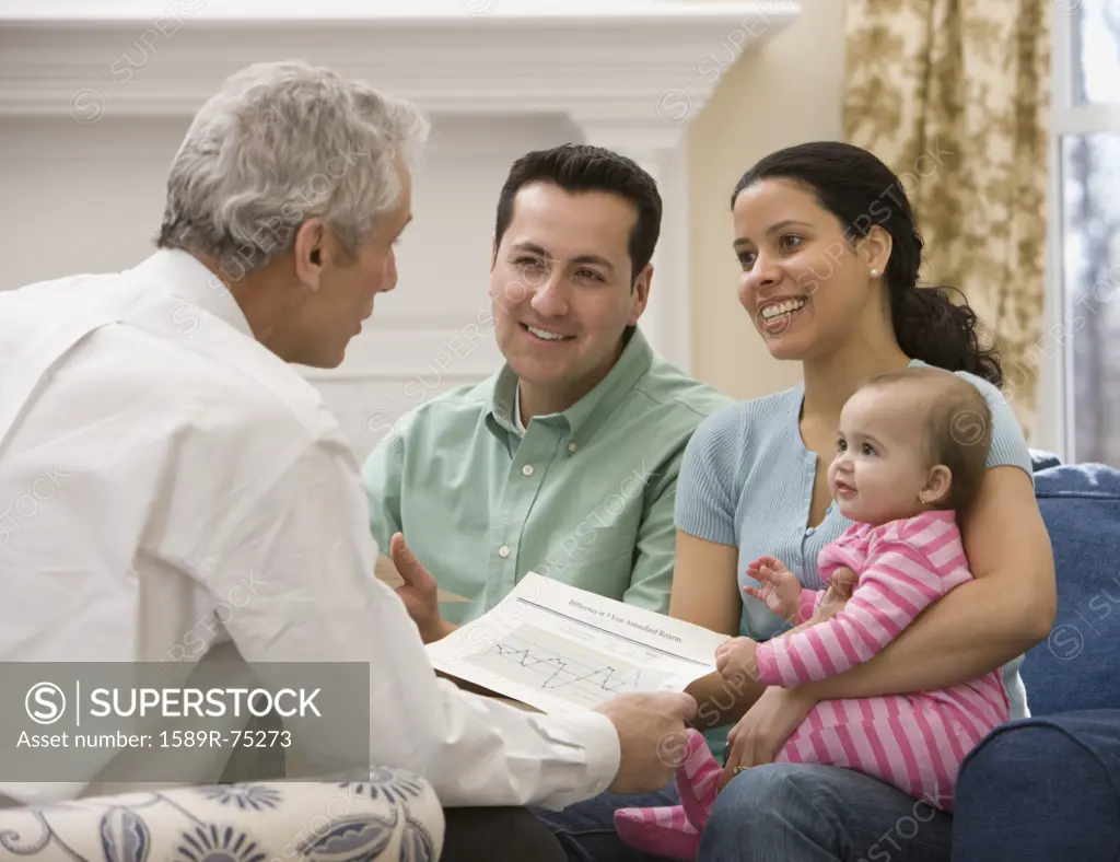 Hispanic family talking with financial advisor