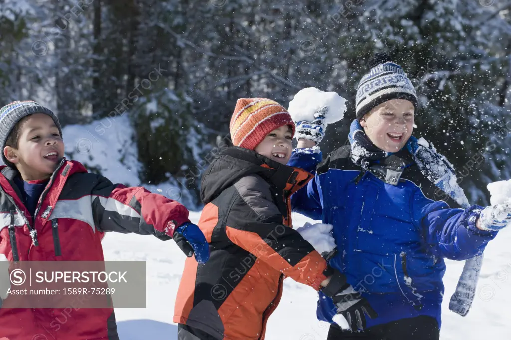 Children throwing snowballs