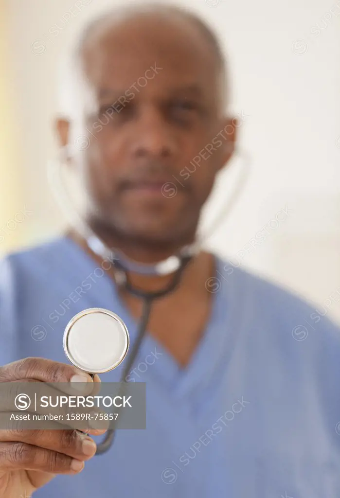 African doctor holding stethoscope