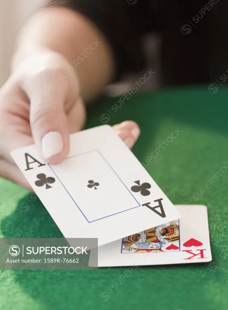 Woman showing black jack hand