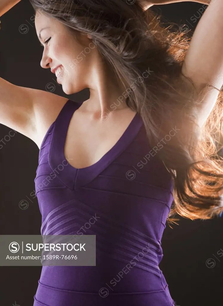 Mixed race woman dancing