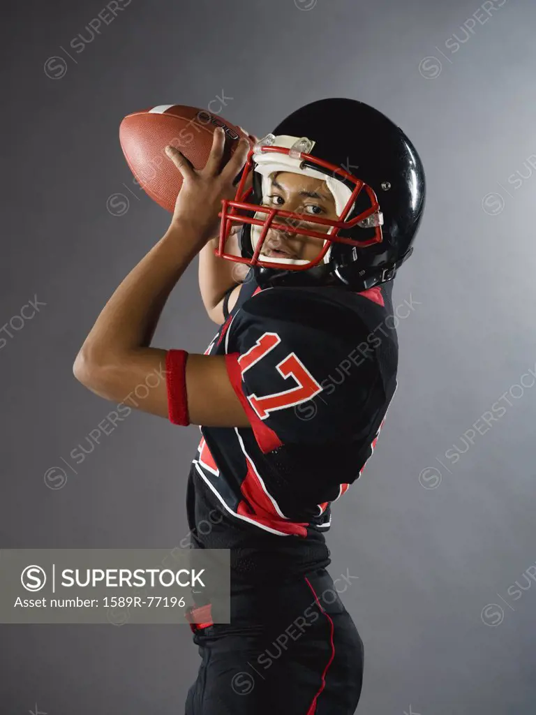 Mixed race quarterback ready to throw football