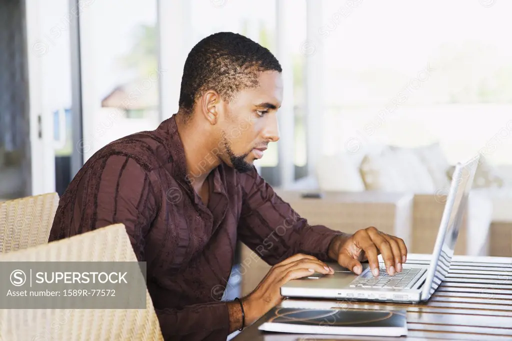 African man using laptop