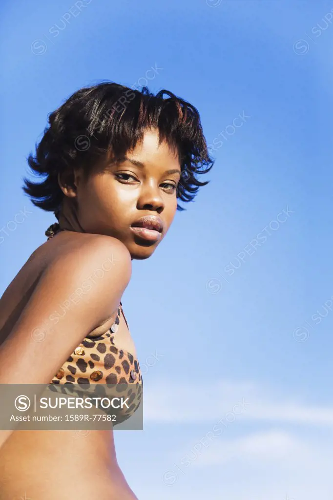 Serious African woman wearing bikini top