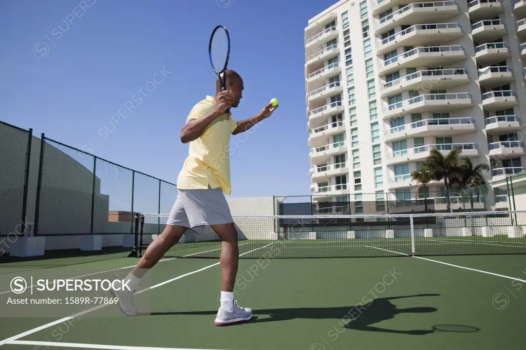 African man playing tennis