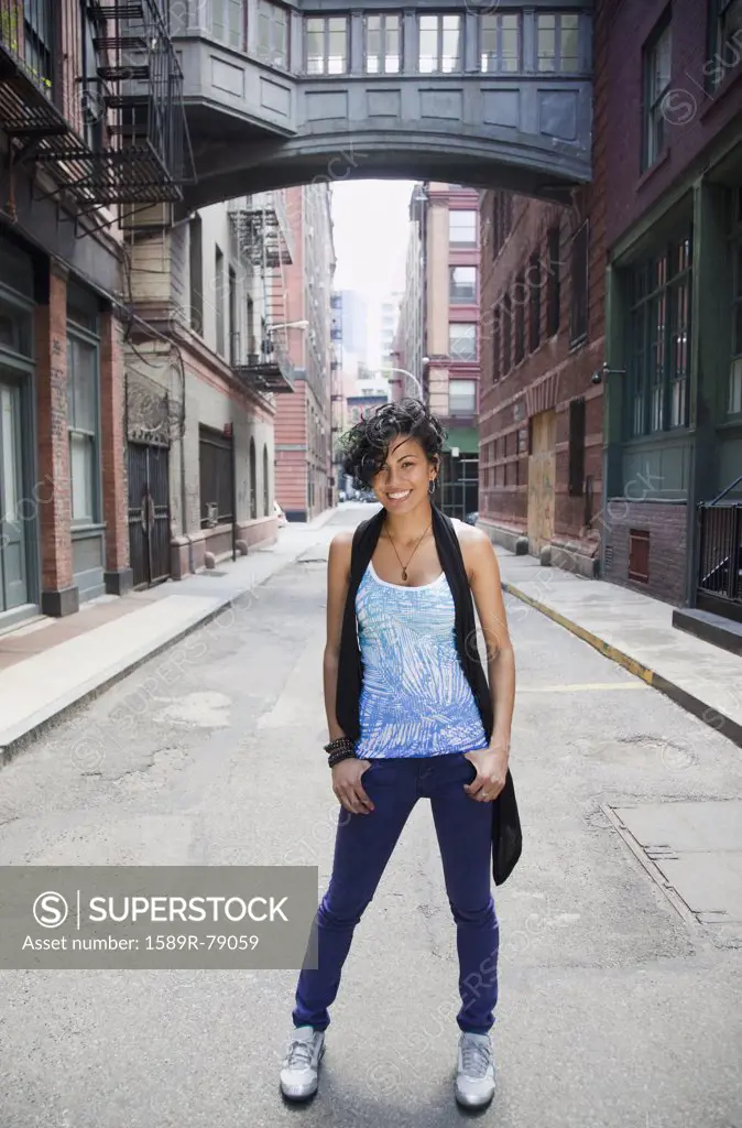 Mixed race woman standing on urban street