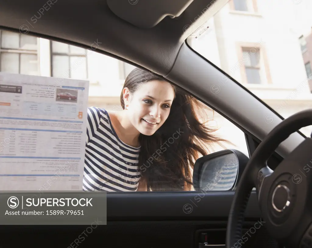 Mixed race woman shopping for new car