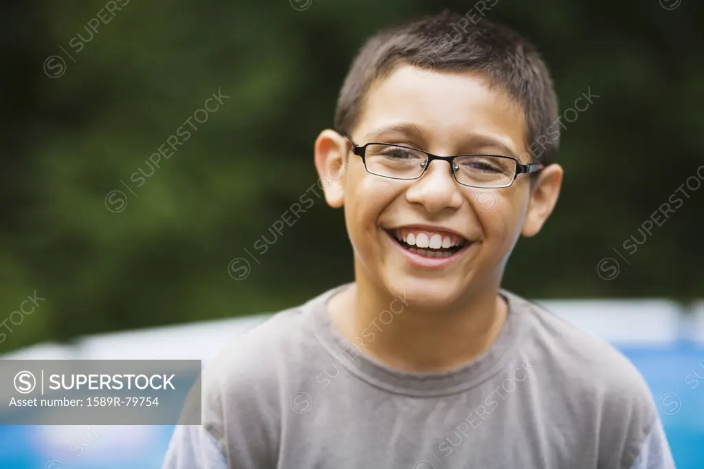 Smiling mixed race boy in eyeglasses