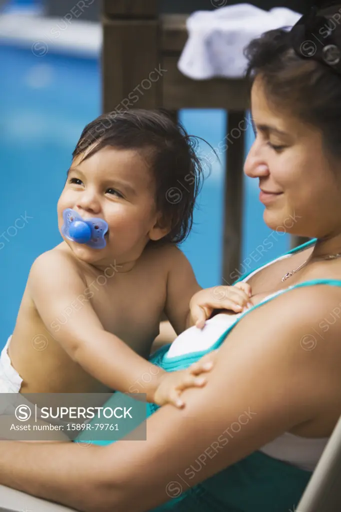 Hispanic mother holding baby boy