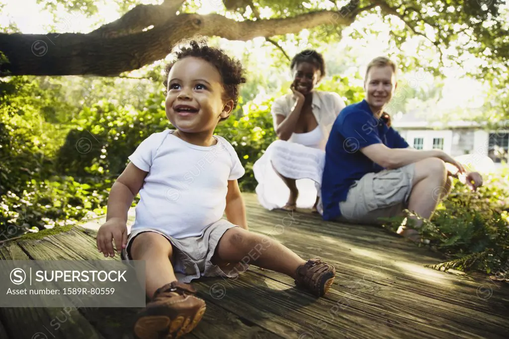 Multi-ethnic family enjoying garden