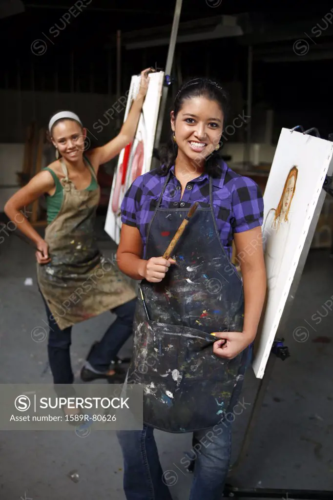 Women painting in artist studio