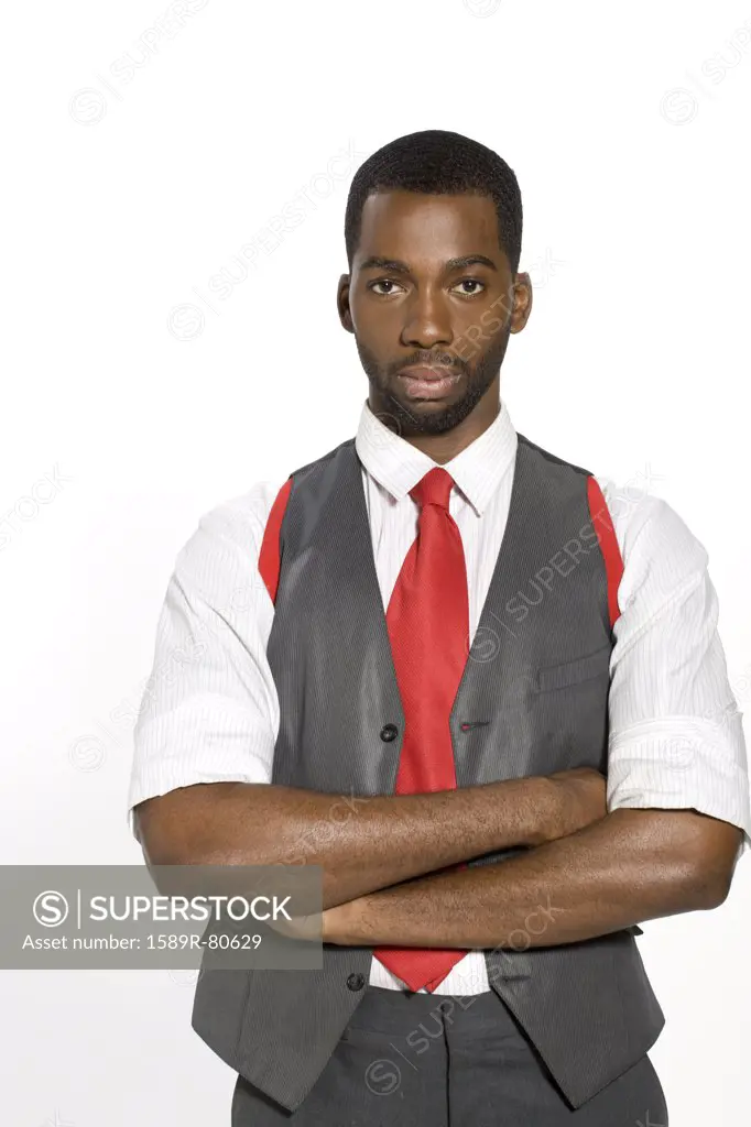 Well-dressed African man with arms crossed