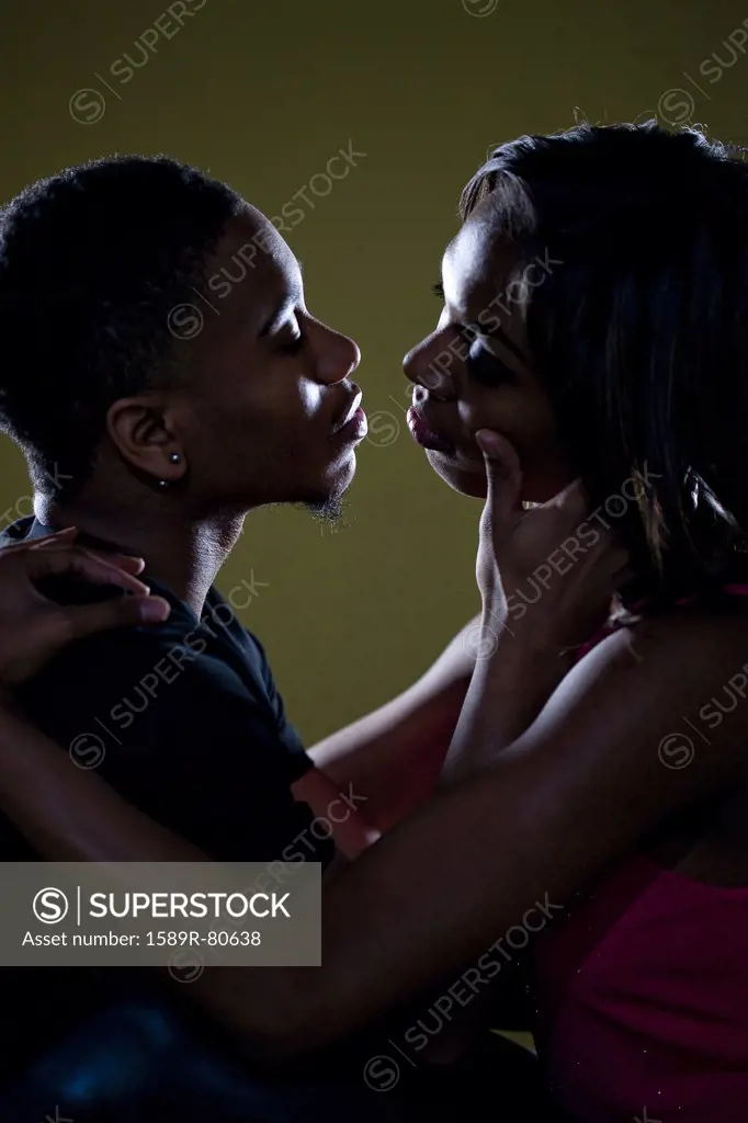 Passionate African couple face to face