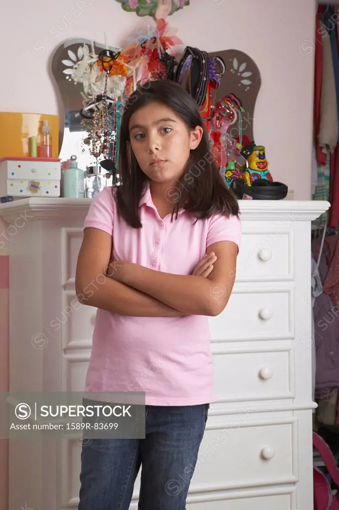 Hispanic girl with arms crossed