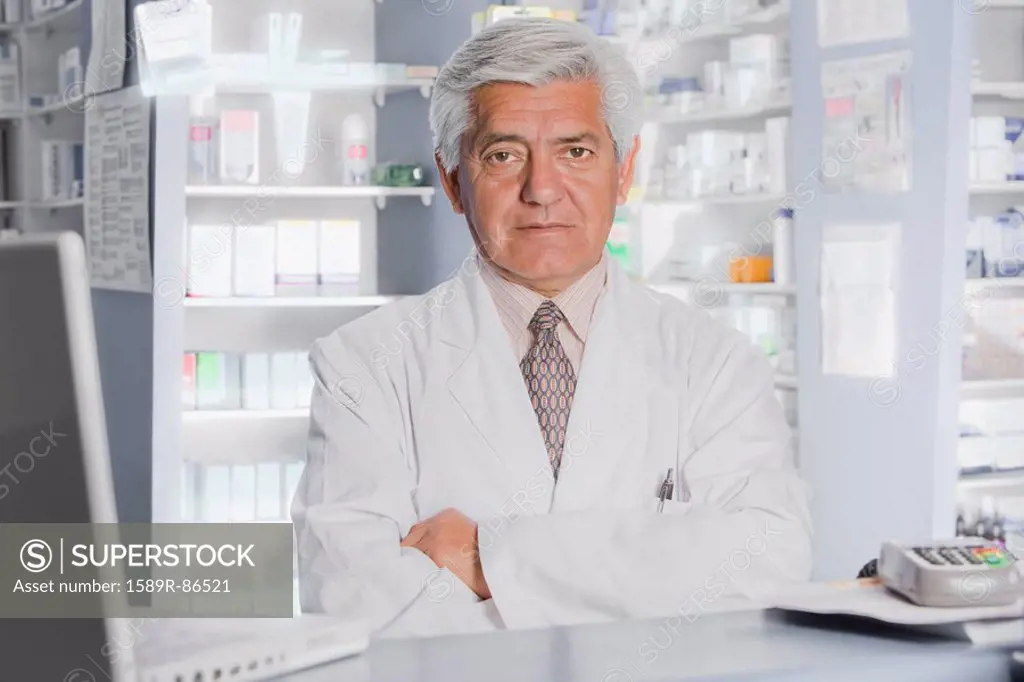 Hispanic pharmacist in drug store