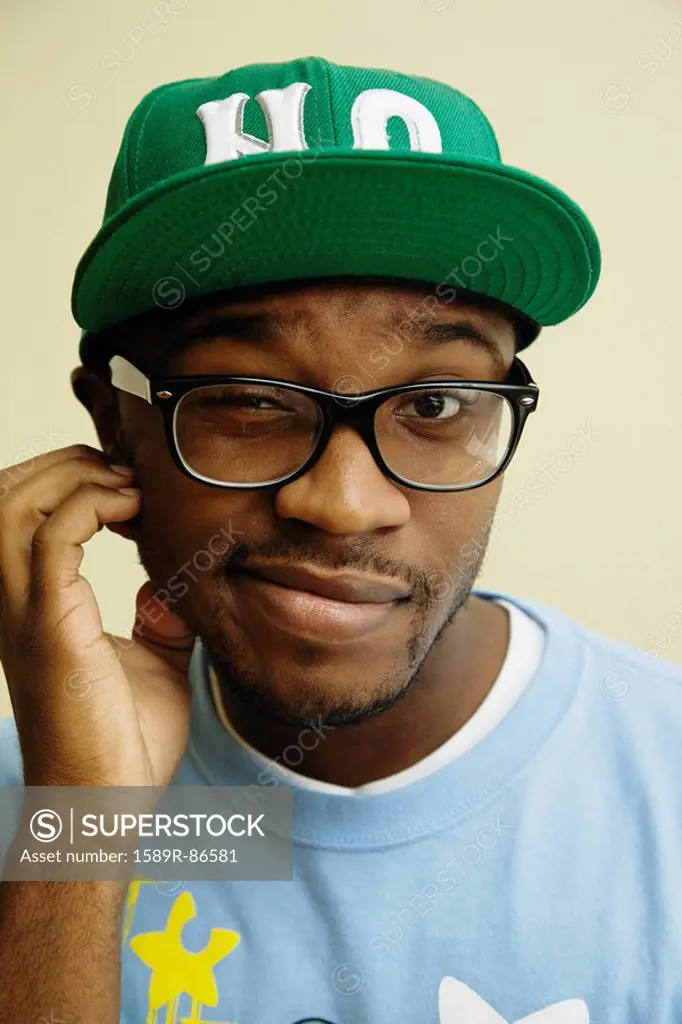 African American man in baseball cap and eyeglasses