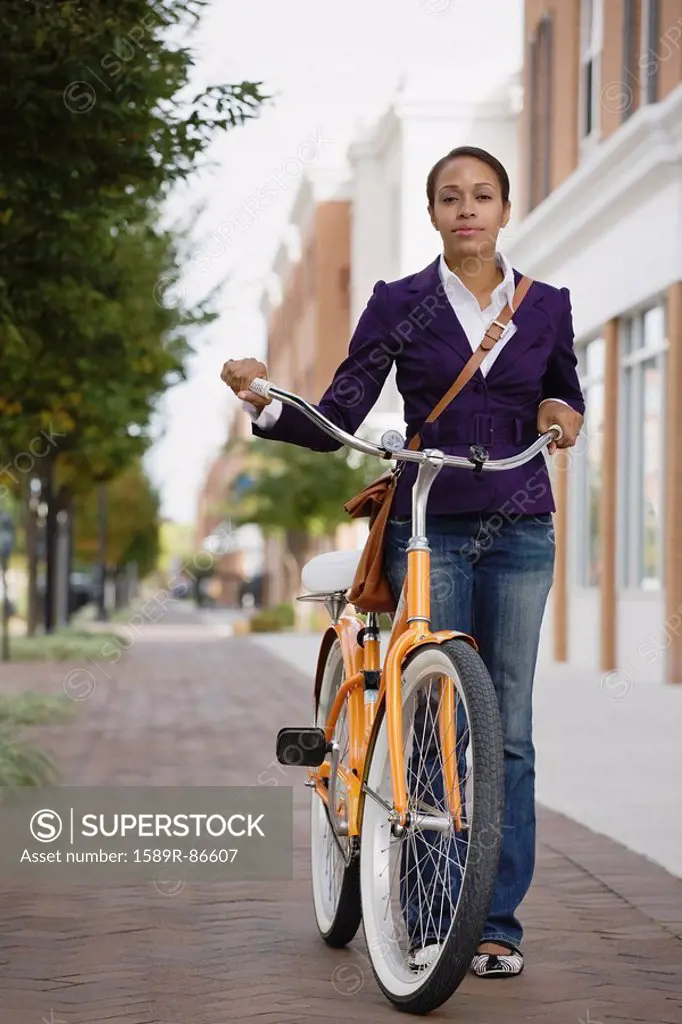 African American woman riding bicycle