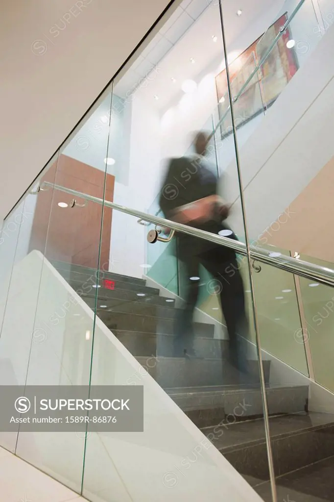 African American businessman descending staircase