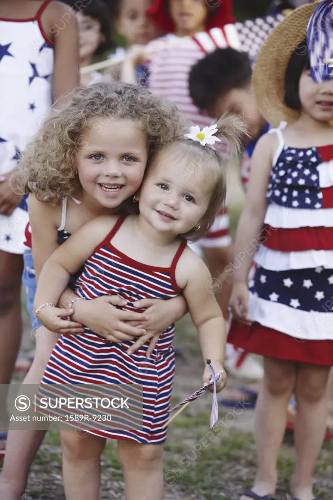 Young sisters at Fourth of July parade