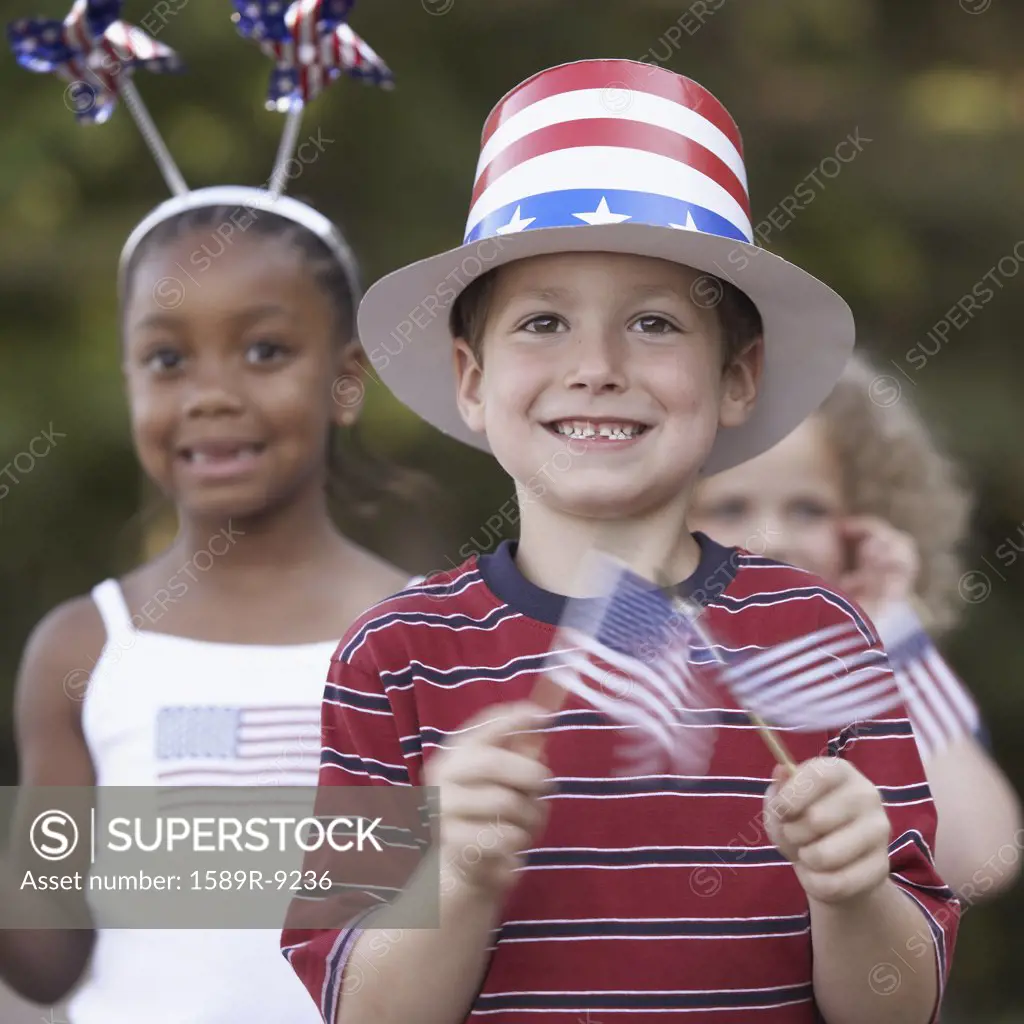 Three children at Fourth of July parade
