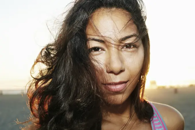 Close up of face of serious Hispanic woman