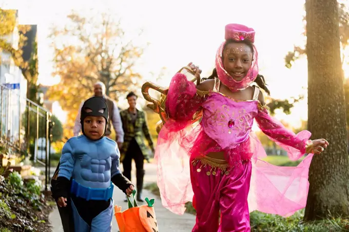 African American children trick-or-treating on Halloween