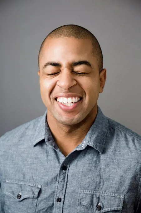 Close up of smiling face of mixed race man