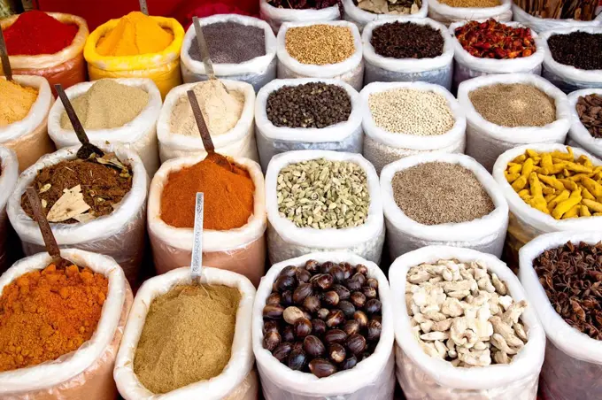 Variety of colorful Indian spices in sacks