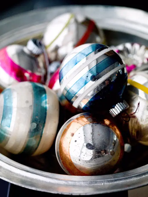 Old-fashioned Christmas ornaments in bowl