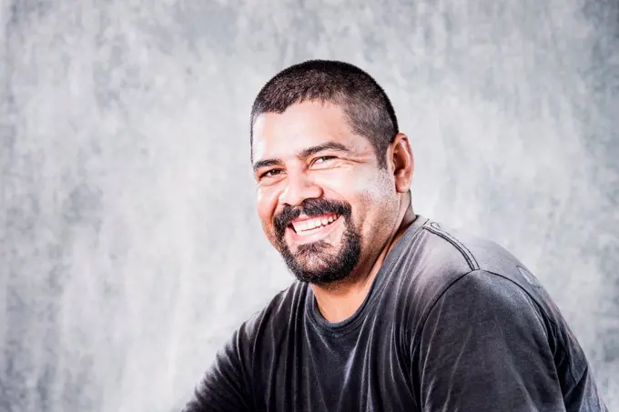 Close up of smiling Hispanic man