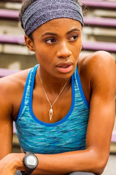 Serious Black athlete sweating