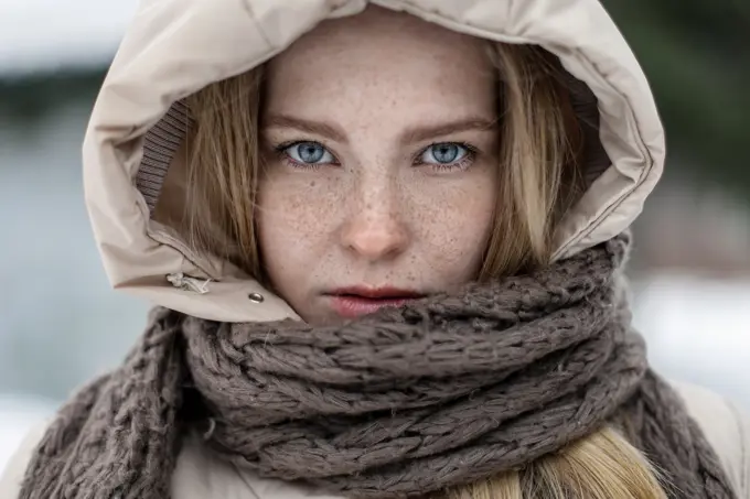 Caucasian woman wearing hood and scarf