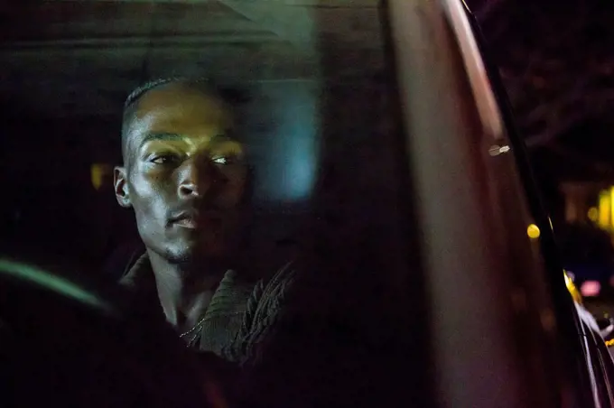 Black man driving car