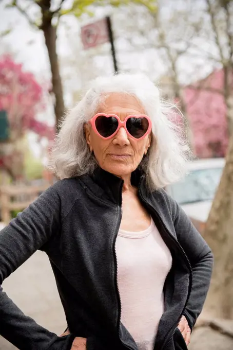Older woman wearing heart-shape sunglasses