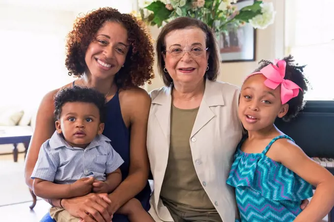 Portrait of smiling mixed race multi-generation family