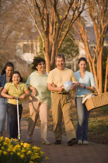Hispanic family walking in park