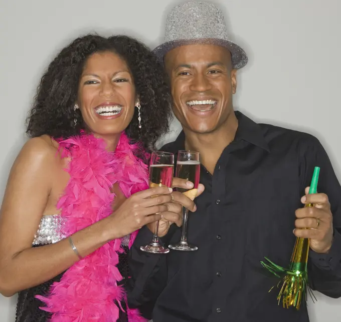 African couple drinking champagne