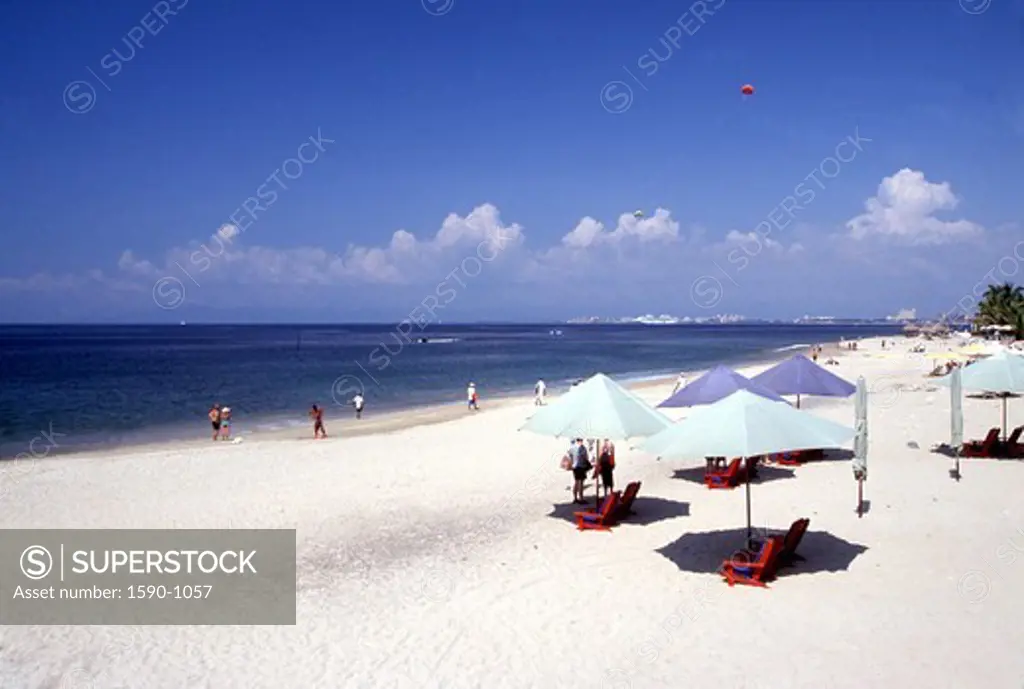 Mexico, Puerto Vallarta, Beach with umbrellas and deck chairs