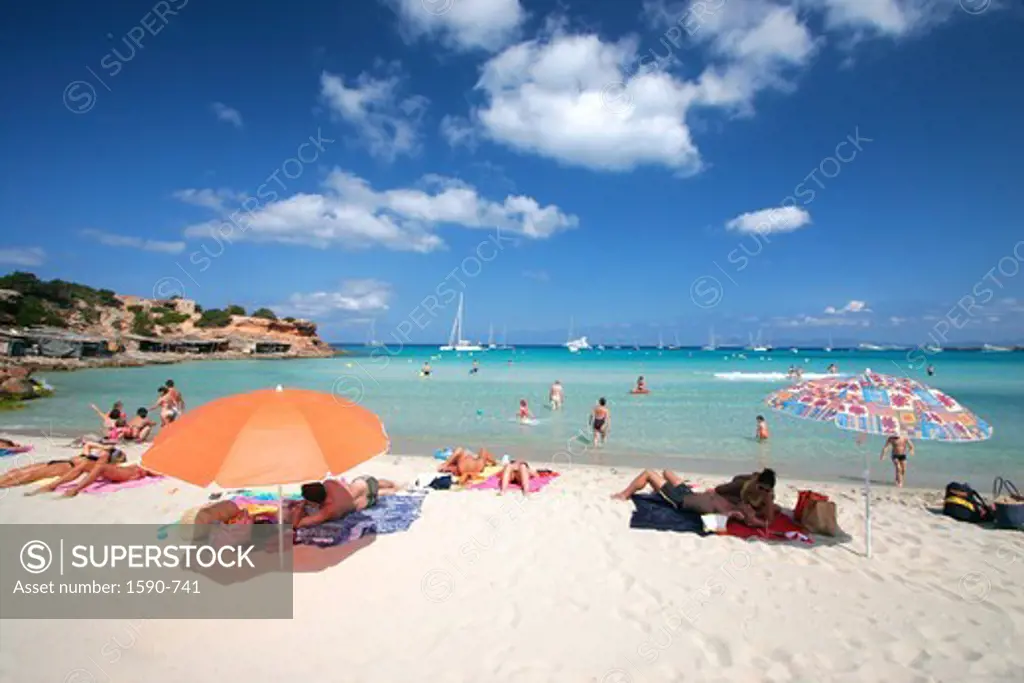 Spain, Formentera, Cala Saona, people sunbathing on beach