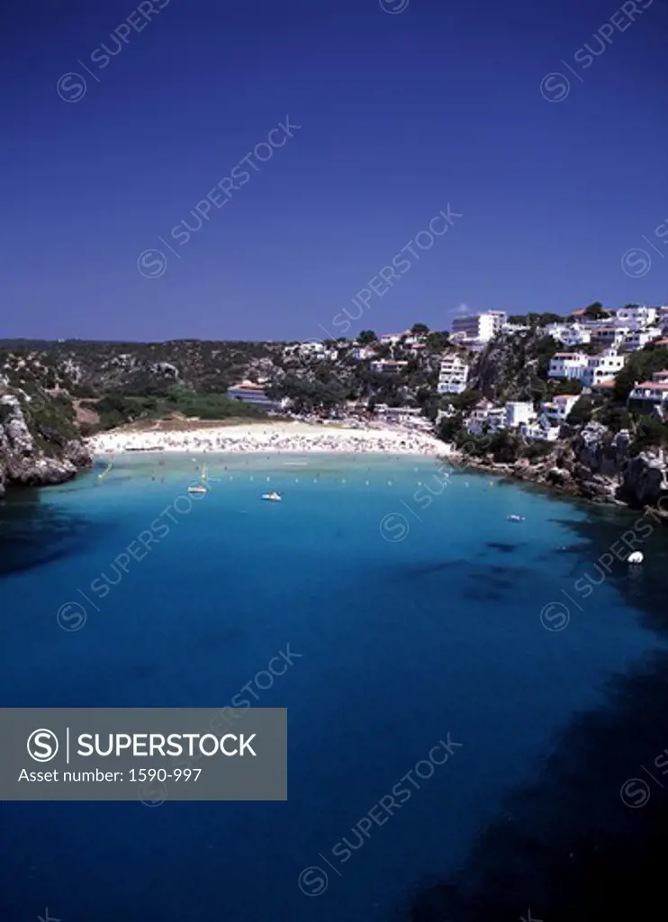 Spain, Minorca, Calan Porter, Elevated view of tourist resort by sea