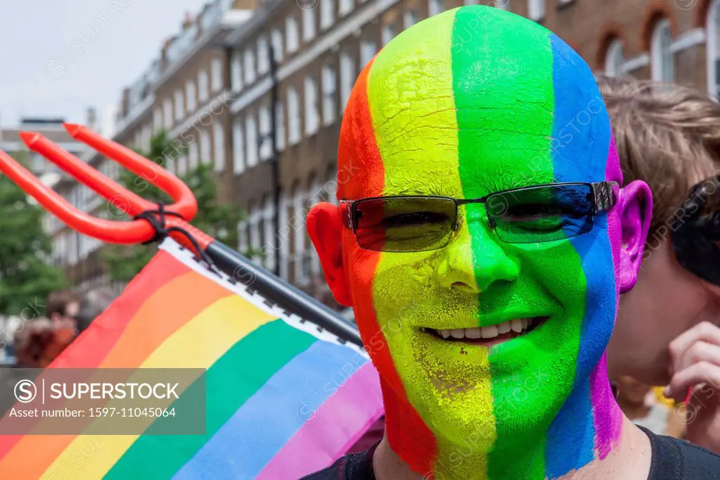 England, London, The Annual Gay Pride Parade, Man with Face Painted in the Gay Pride Colours
